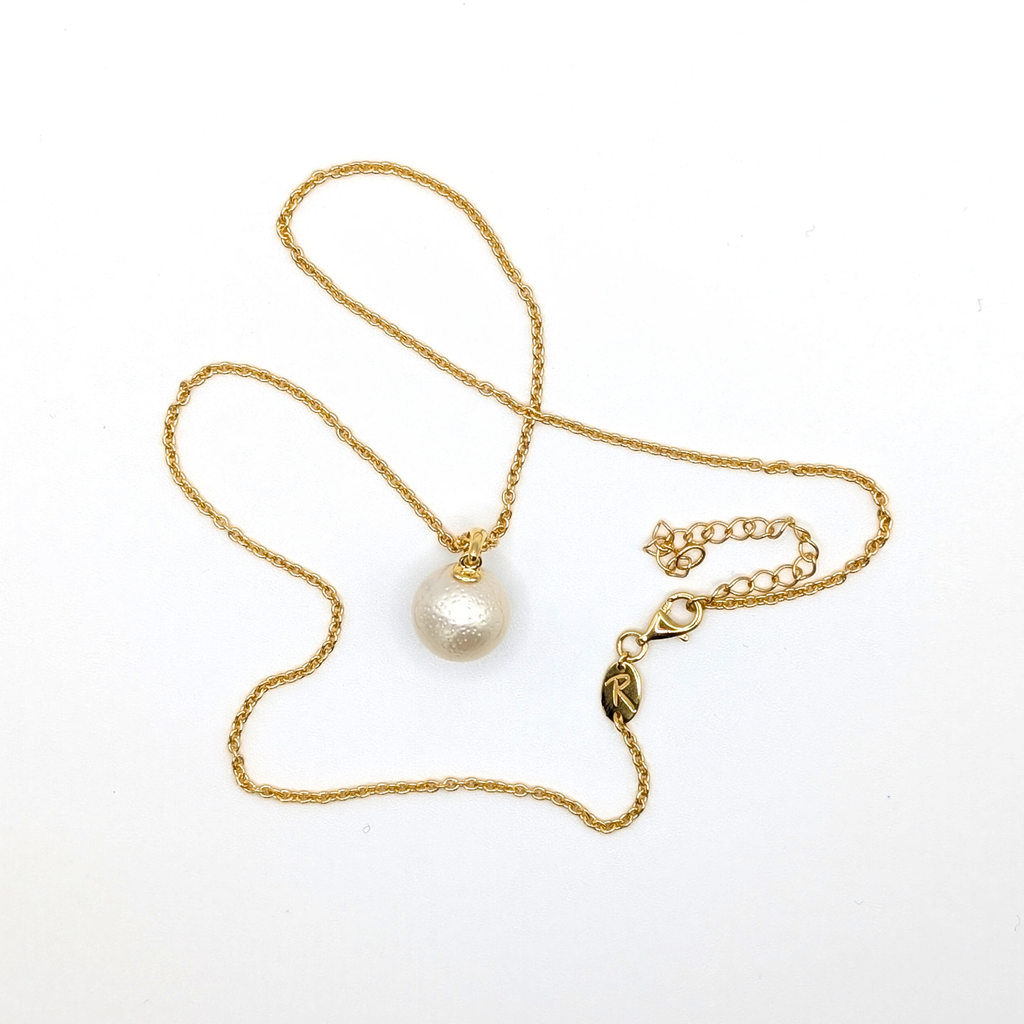 White south sea pearl pendant necklace with gold vermeil chain on white background