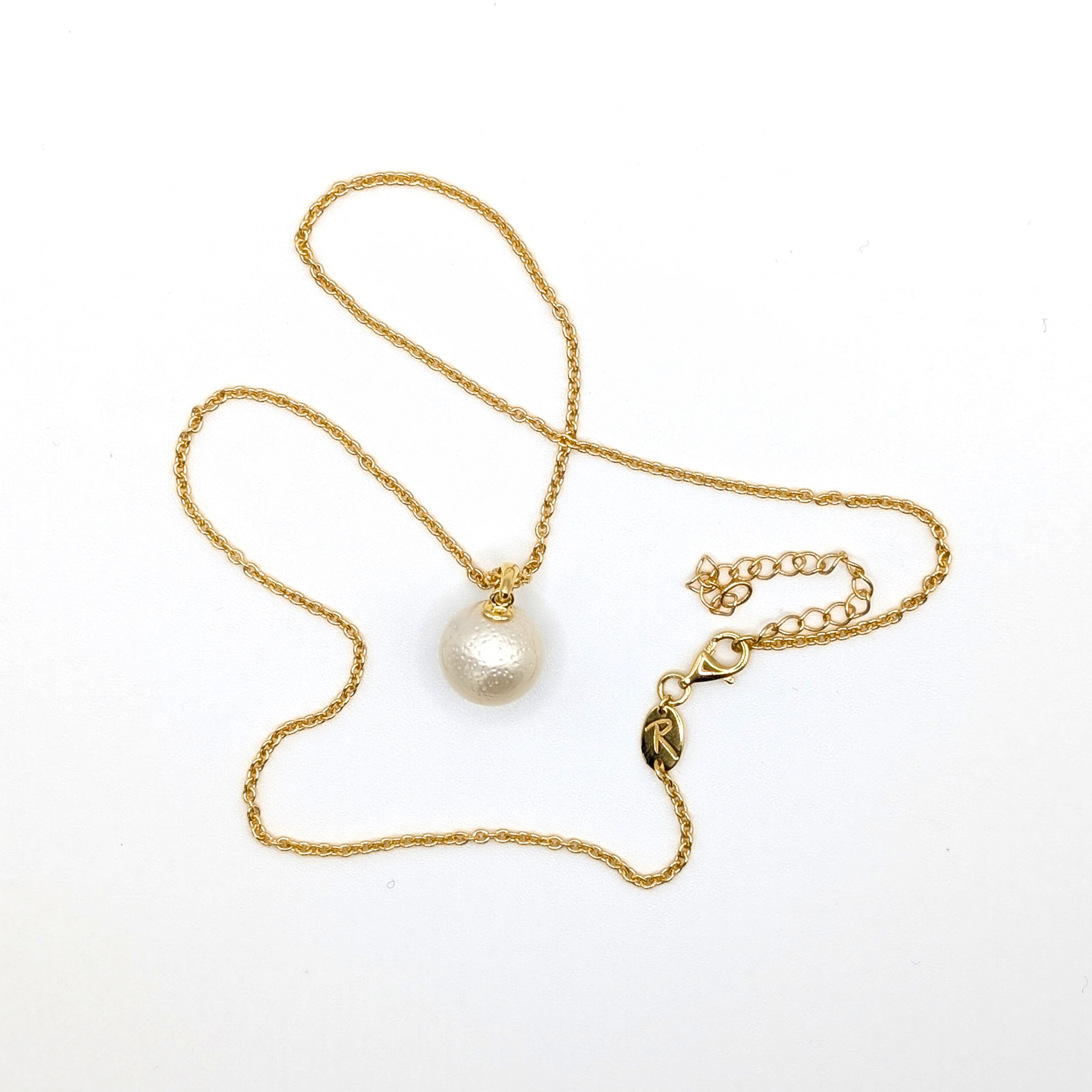 White south sea pearl pendant necklace with gold vermeil chain on white background