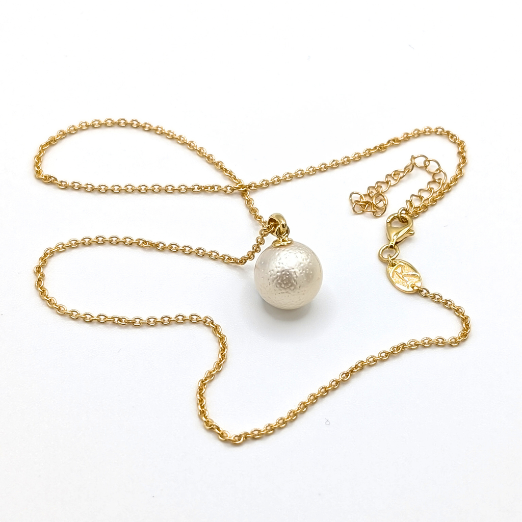 White south sea pearl pendant necklace with gold vermeil chain on white background