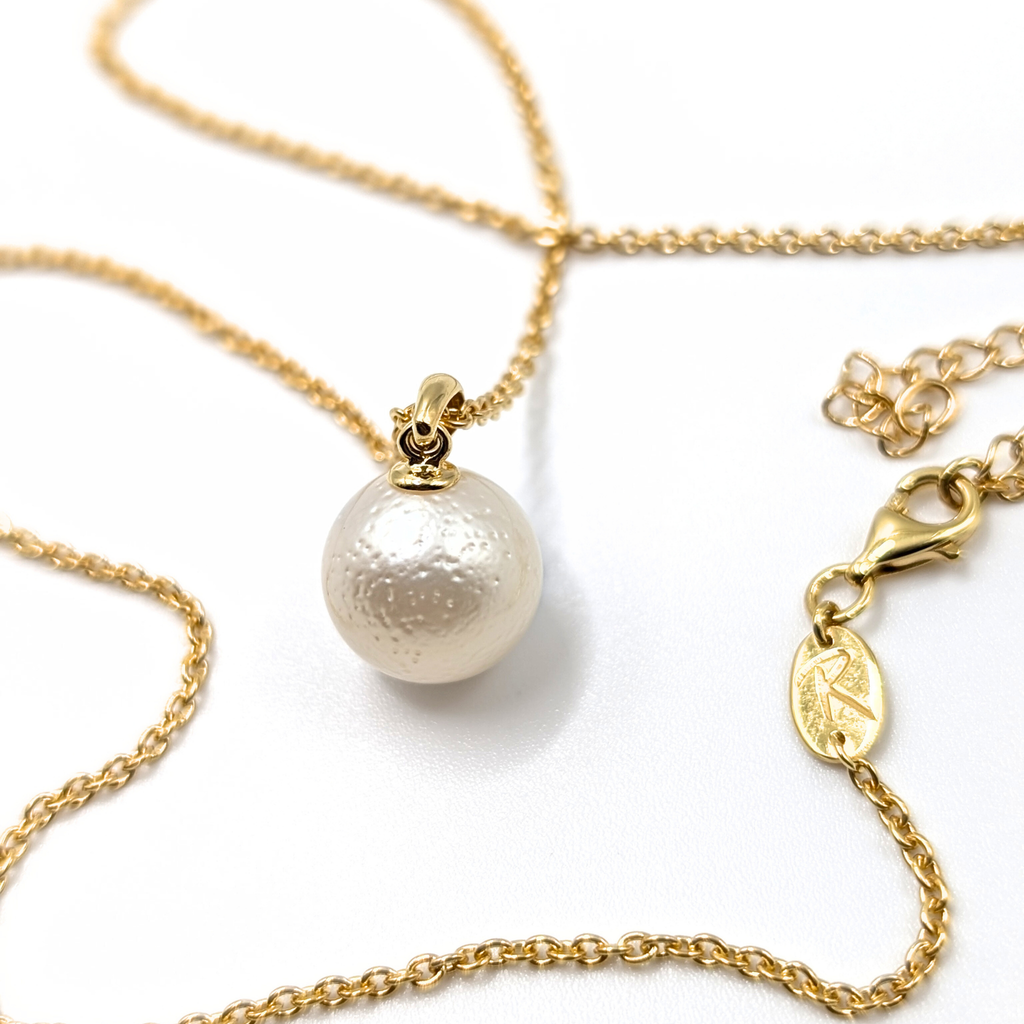 White south sea pearl pendant necklace with gold vermeil chain on white background
