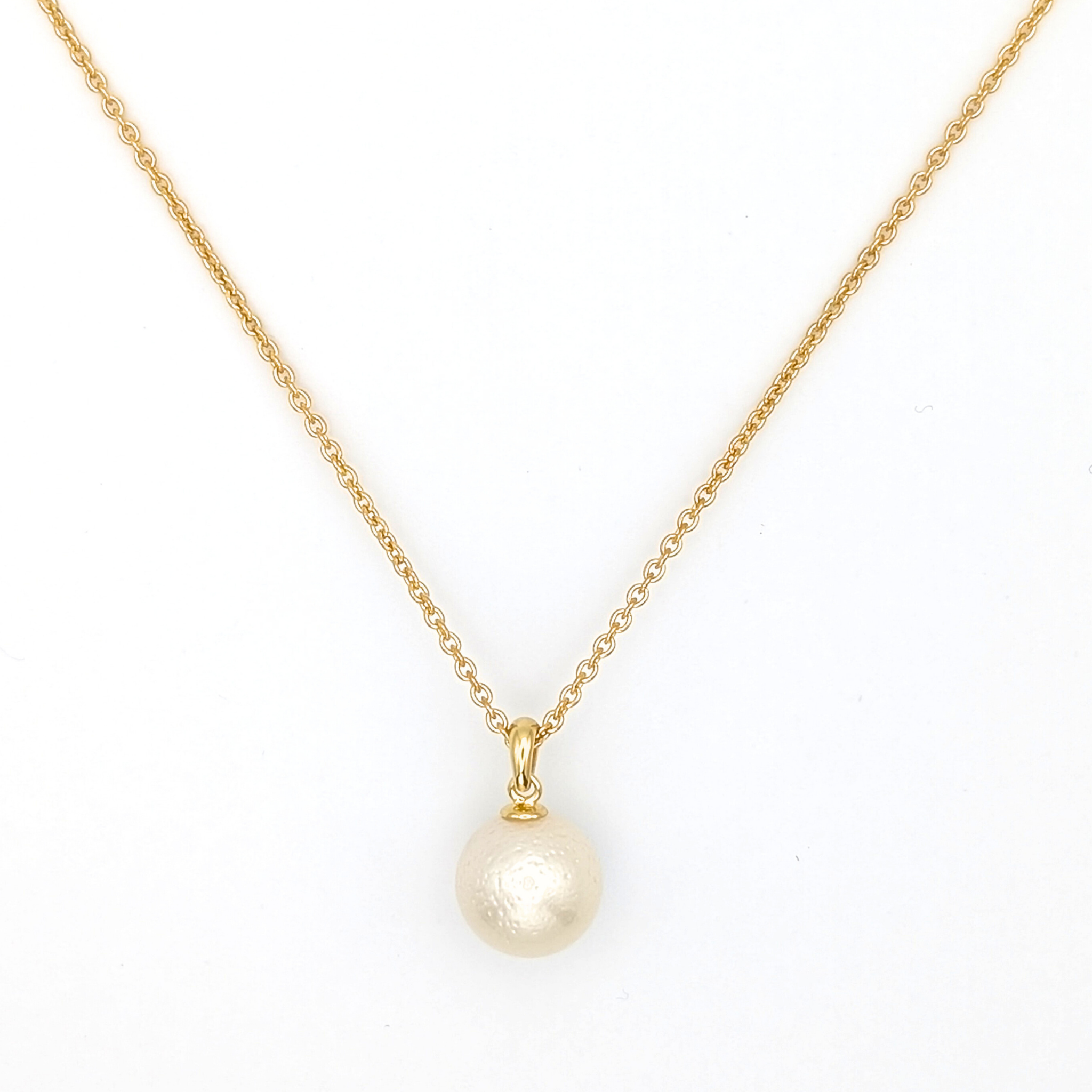 White south sea pearl pendant necklace with gold vermeil chain on white background