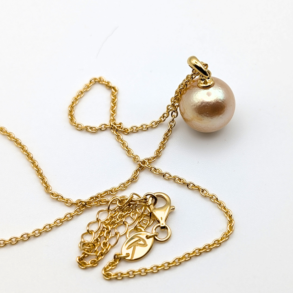 coppery gold south sea pearl pendant necklace with gold vermeil bail and chain on white background