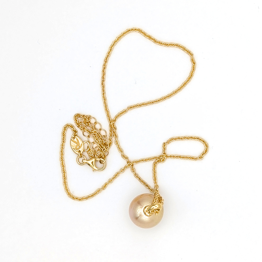 coppery gold south sea pearl pendant necklace with gold vermeil bail and chain on white background