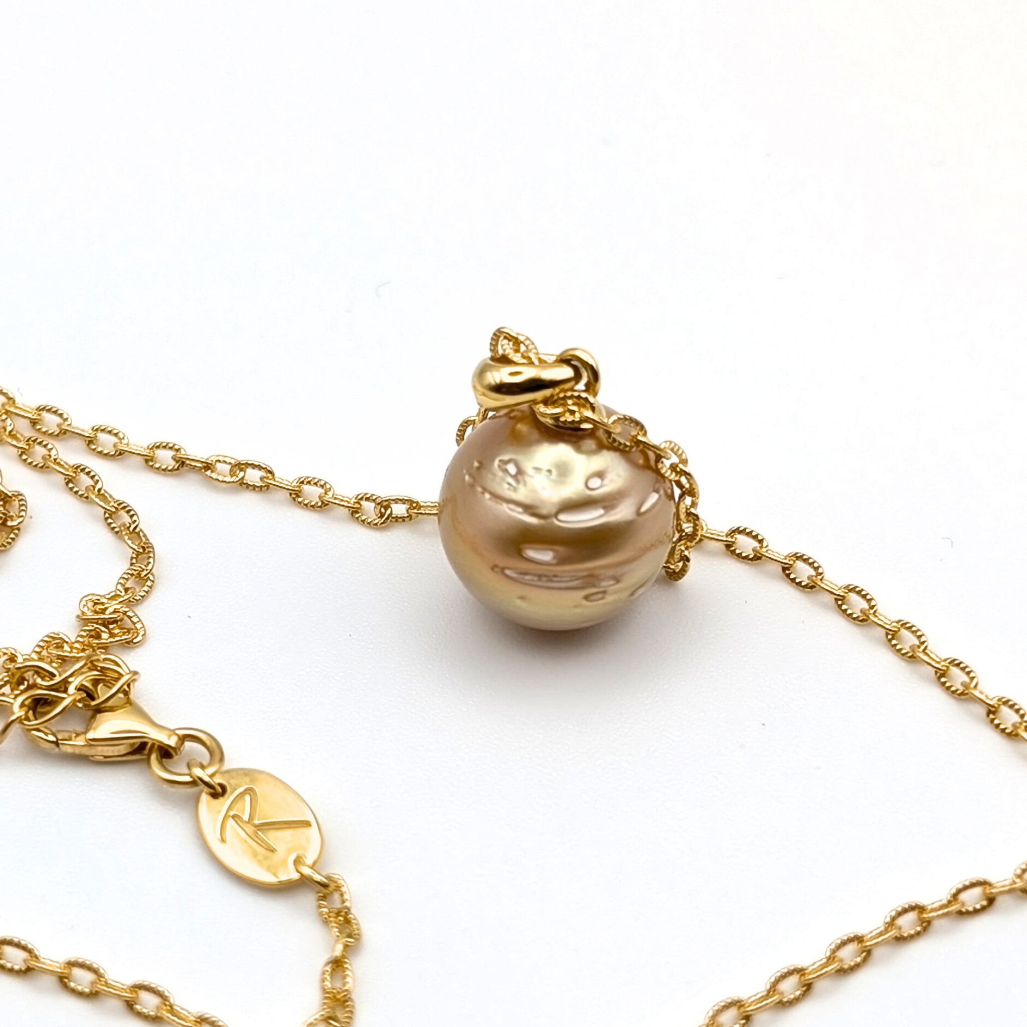 deep contour gold south sea pearl pendant necklace with gold vermeil chain on white background