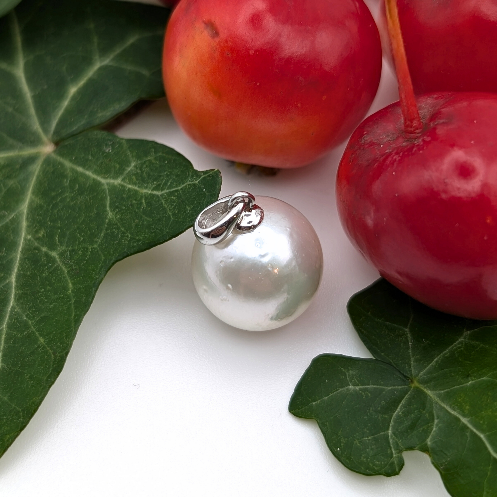 Extra large silver south sea pearl pendant necklace with rhodium plated sterling silver chain with ivy & crab-apple background