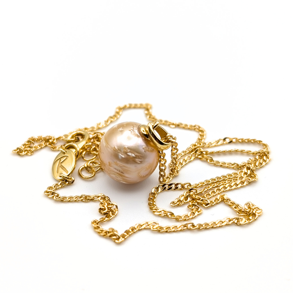 Gold vermeil necklace with a gold south sea pearl pendant on a white background