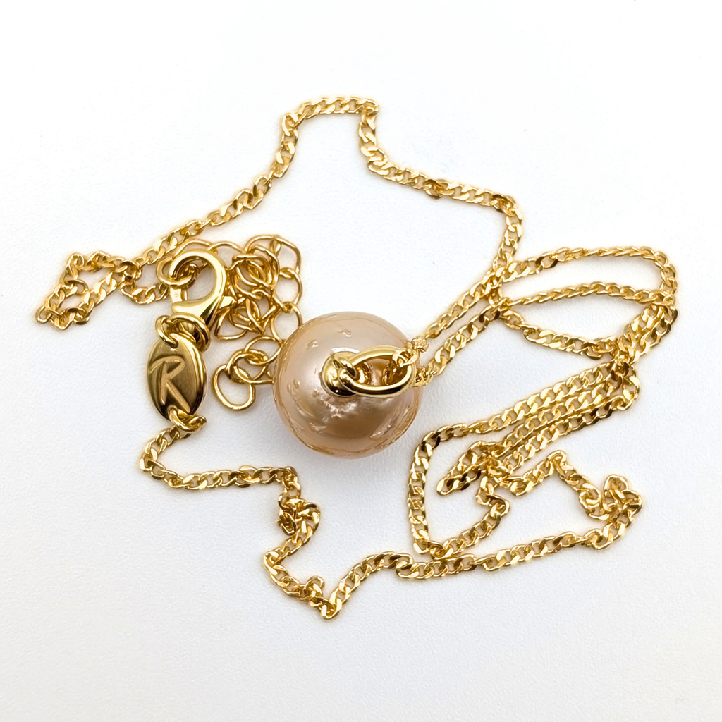 Gold vermeil necklace with a gold south sea pearl pendant on a white background