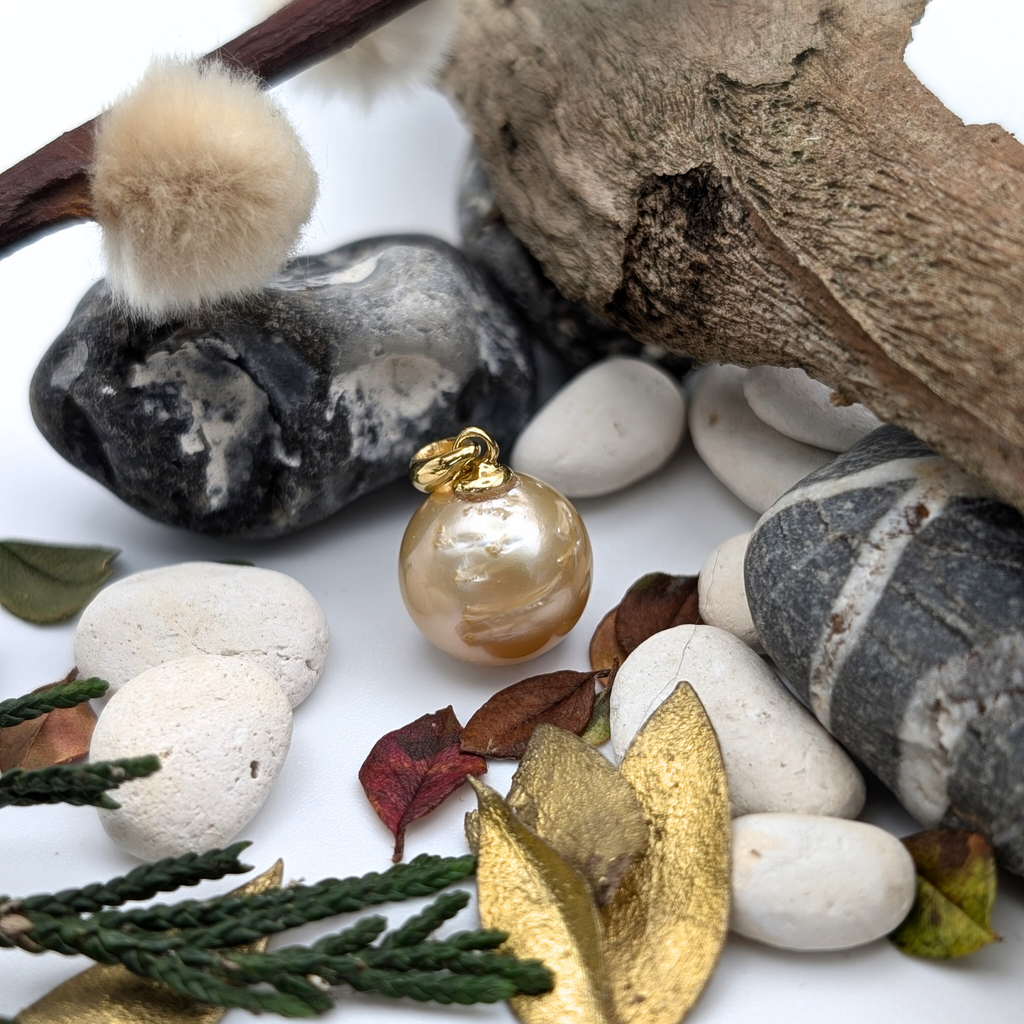 Gold vermeil necklace with a gold south sea pearl pendant on a white background