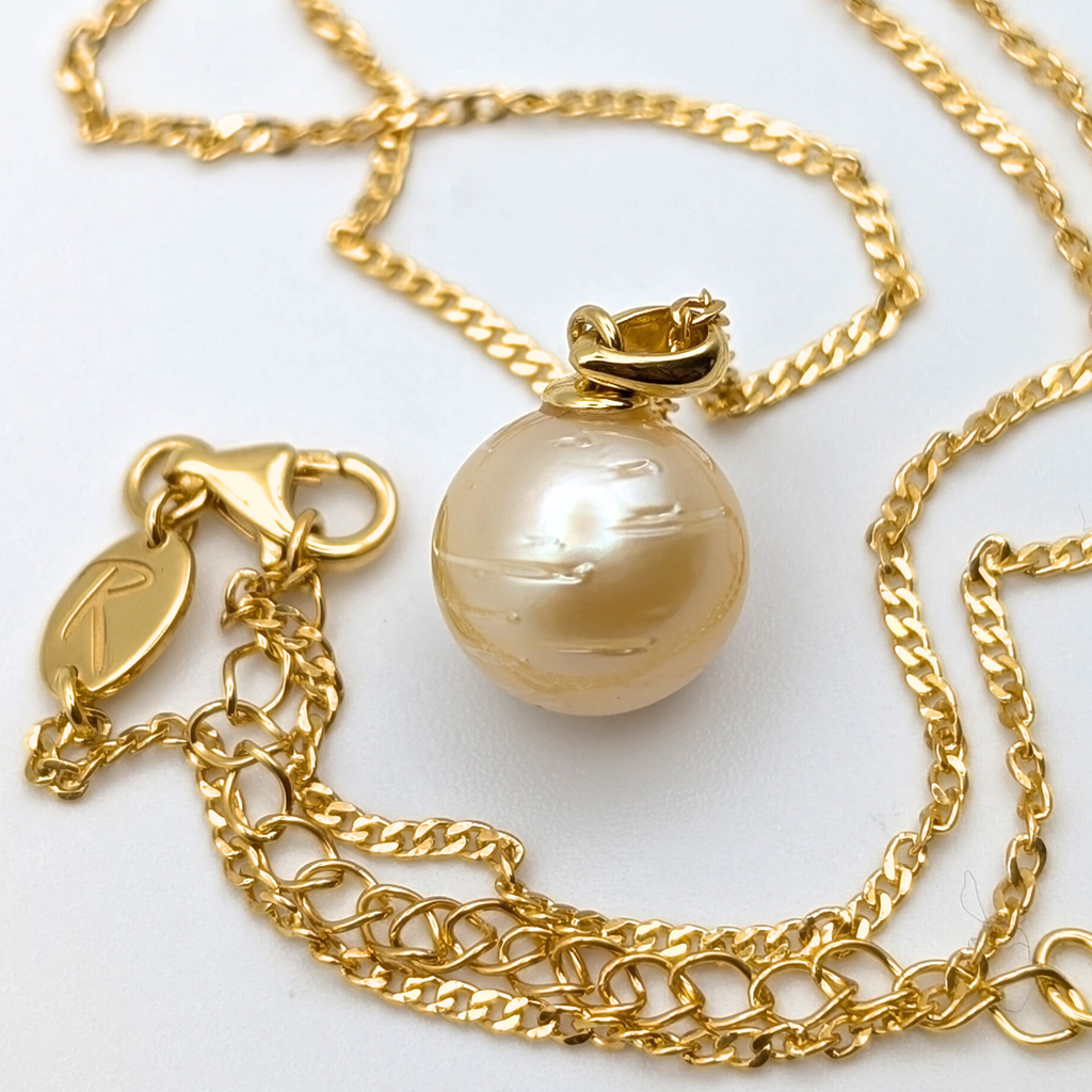 Gold vermeil necklace with a large gold south sea pearl pendant on a white background