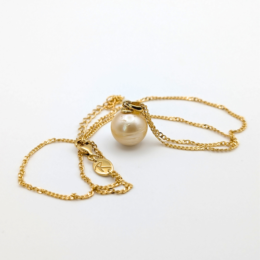 Gold vermeil necklace with a large gold south sea pearl pendant on a white background
