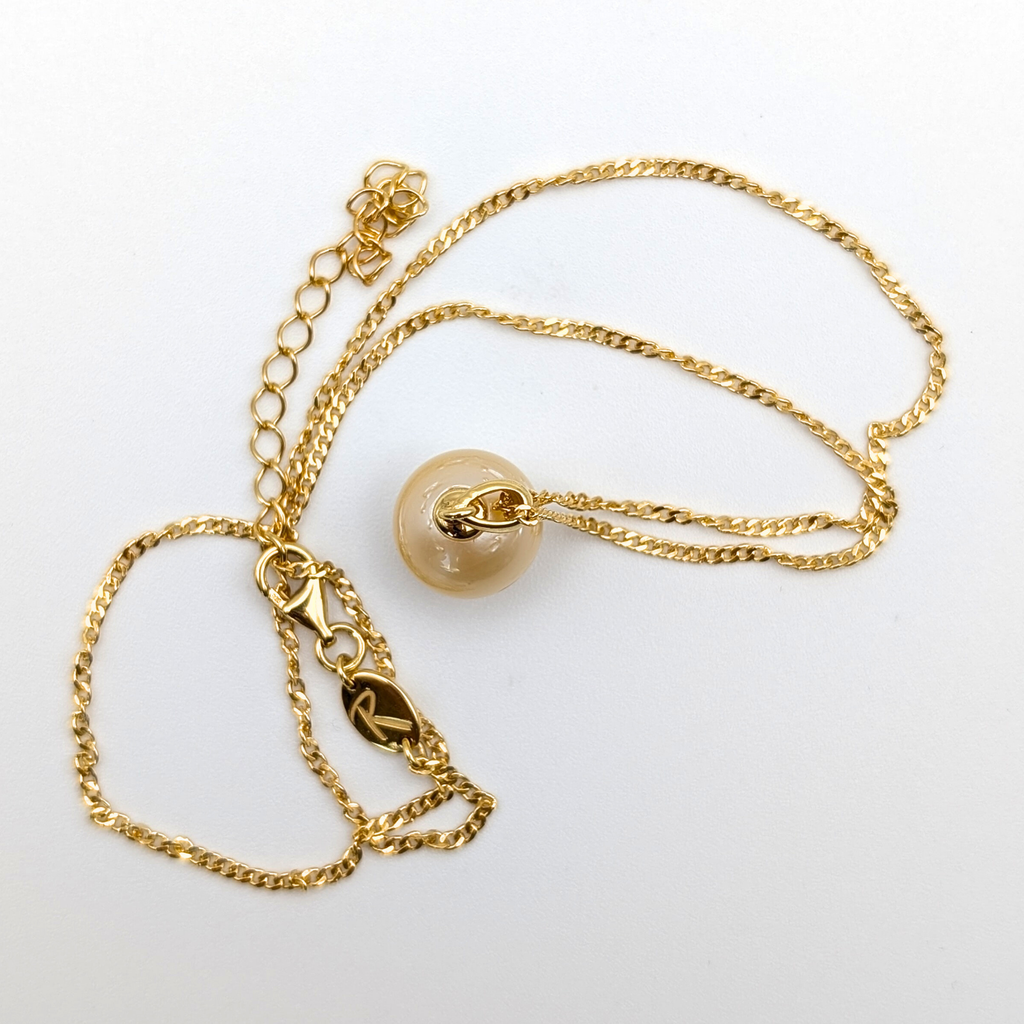 Gold vermeil necklace with a large gold south sea pearl pendant on a white background
