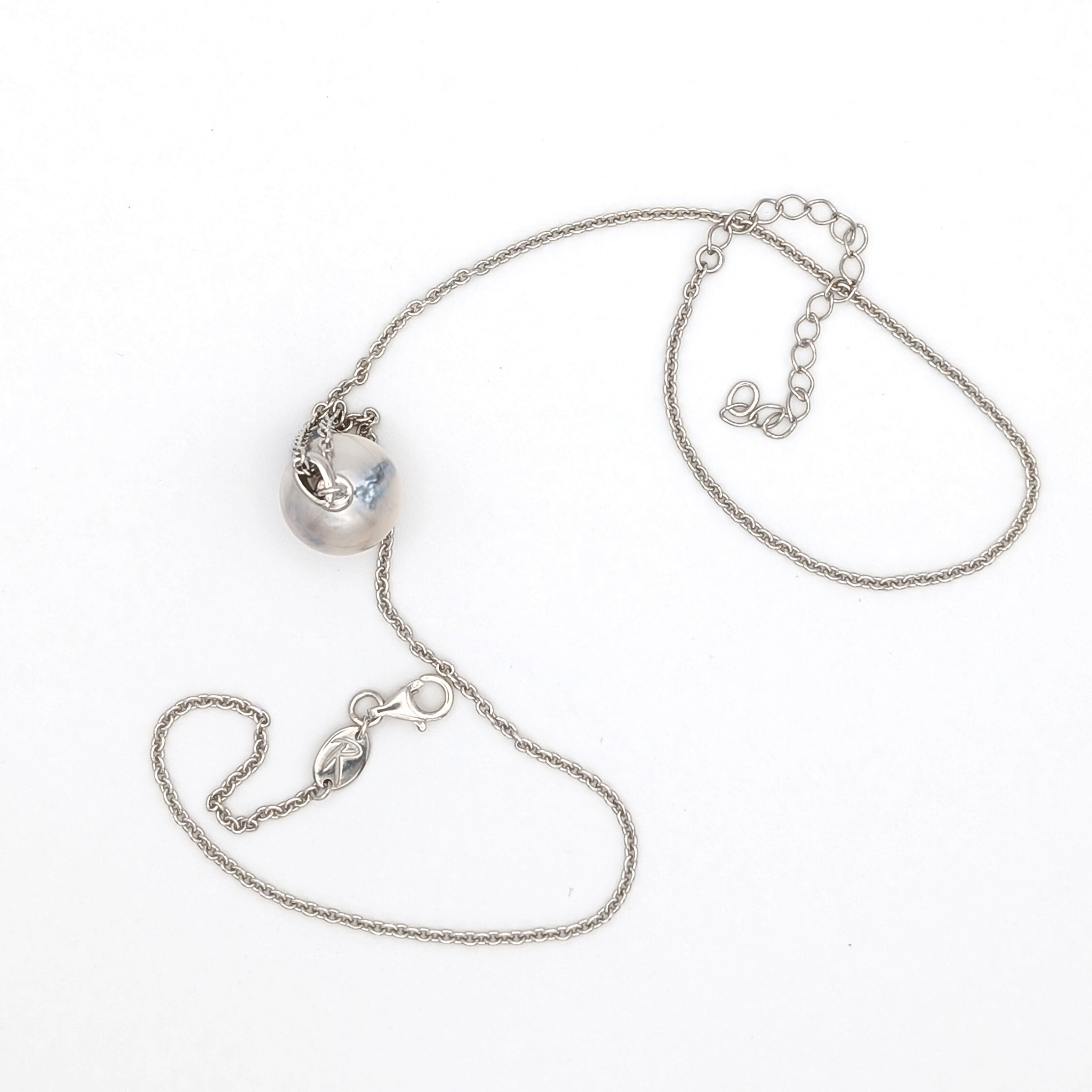 Rhodium plated sterling silver necklace with a large silver south sea pearl pendant on a white background
