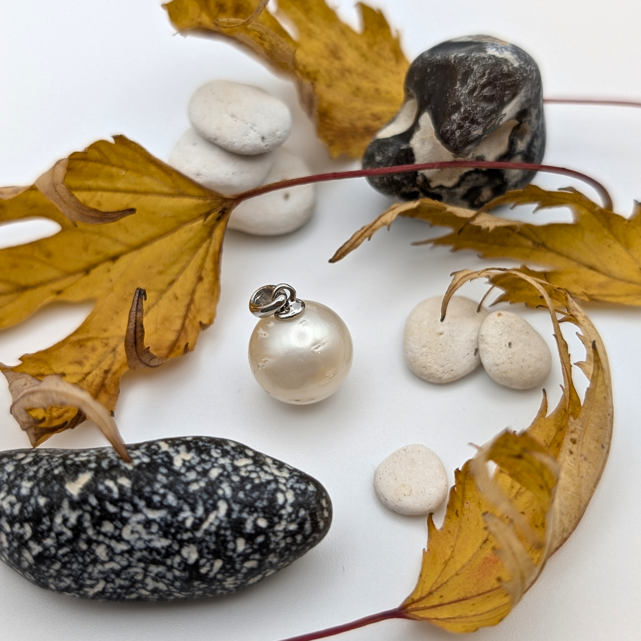 Rhodium plated sterling silver necklace with a large white spotted south sea pearl pendant lifestyle image