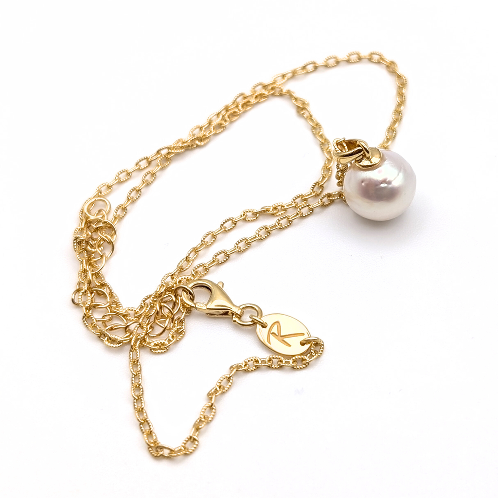 Gold vermeil chain with a white south sea pearl pendant on a white background