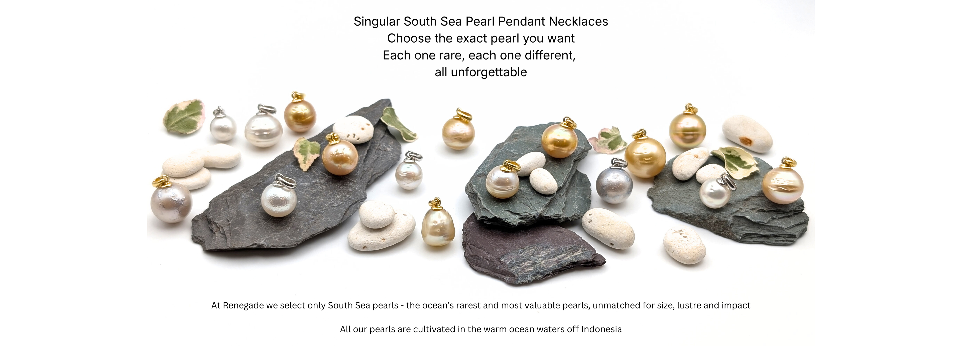 A collection of South Sea pearl pendants in white, champagne, gold and silver-grey, arranged on natural slate stones with pebbles and leaves