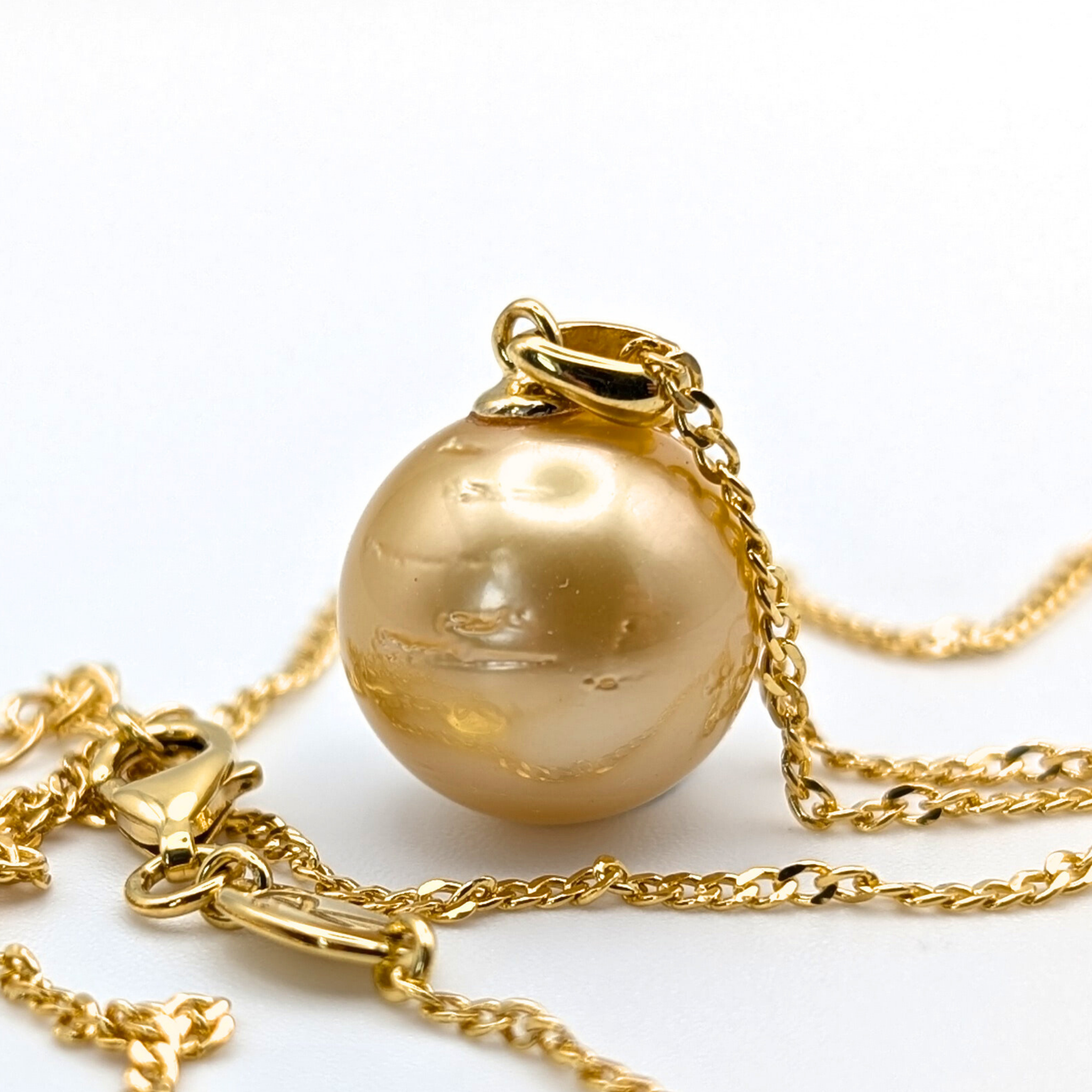 Gold vermeil necklace with an extra large south sea pearl pendant on a white background