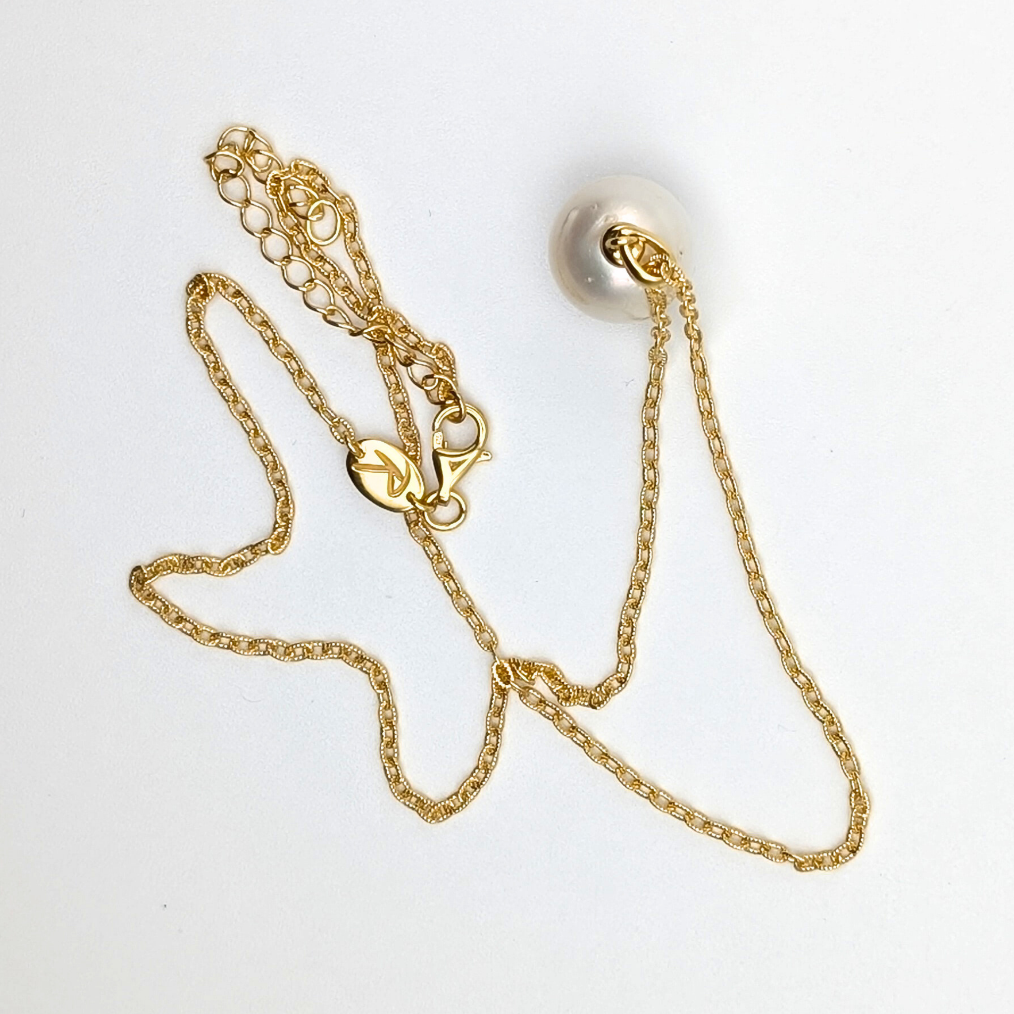 white  south sea pearl pendant necklace with gold vermeil bail and chain on white background