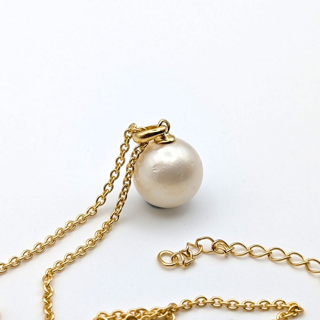 white  south sea pearl pendant necklace with gold vermeil bail and chain on white background
