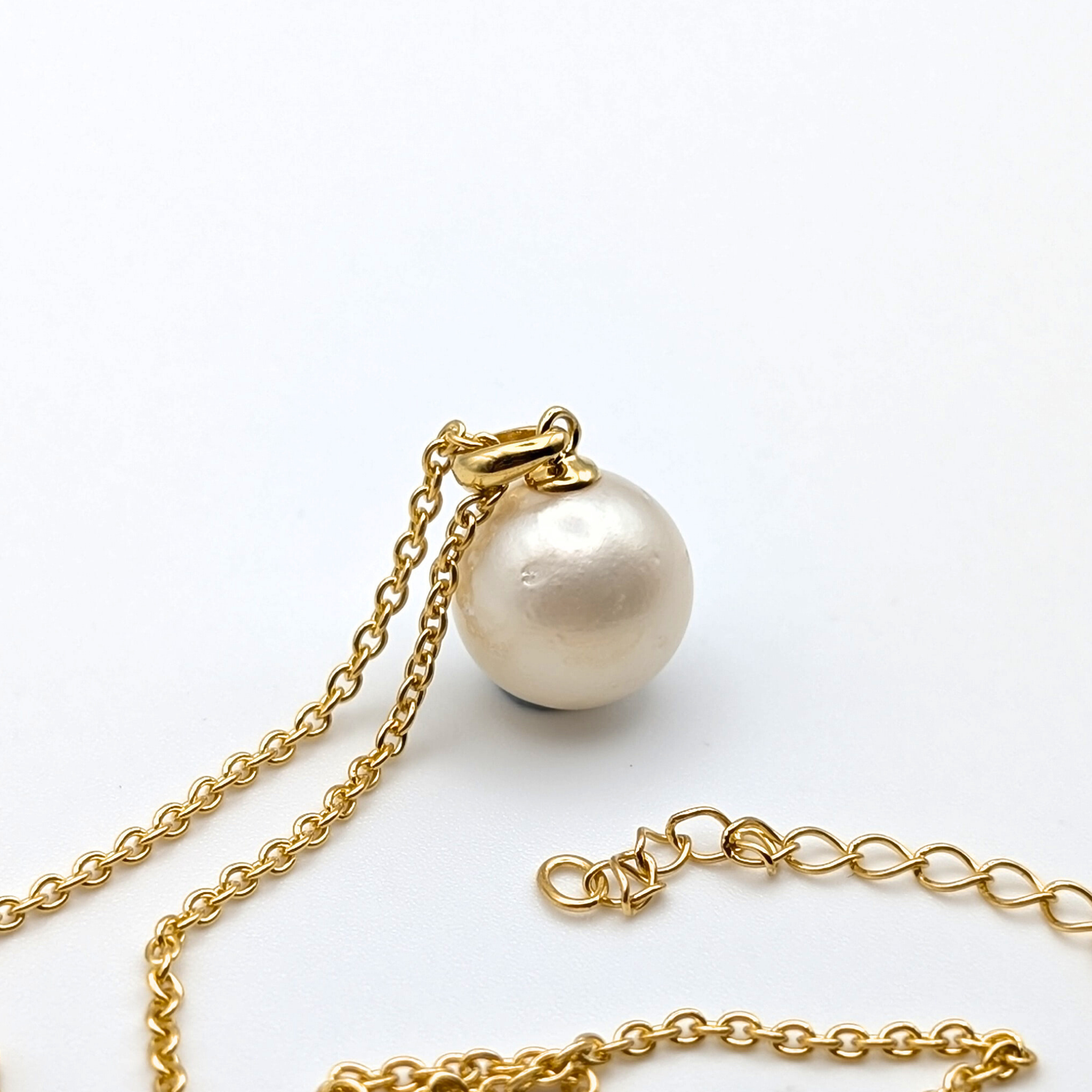 white  south sea pearl pendant necklace with gold vermeil bail and chain on white background