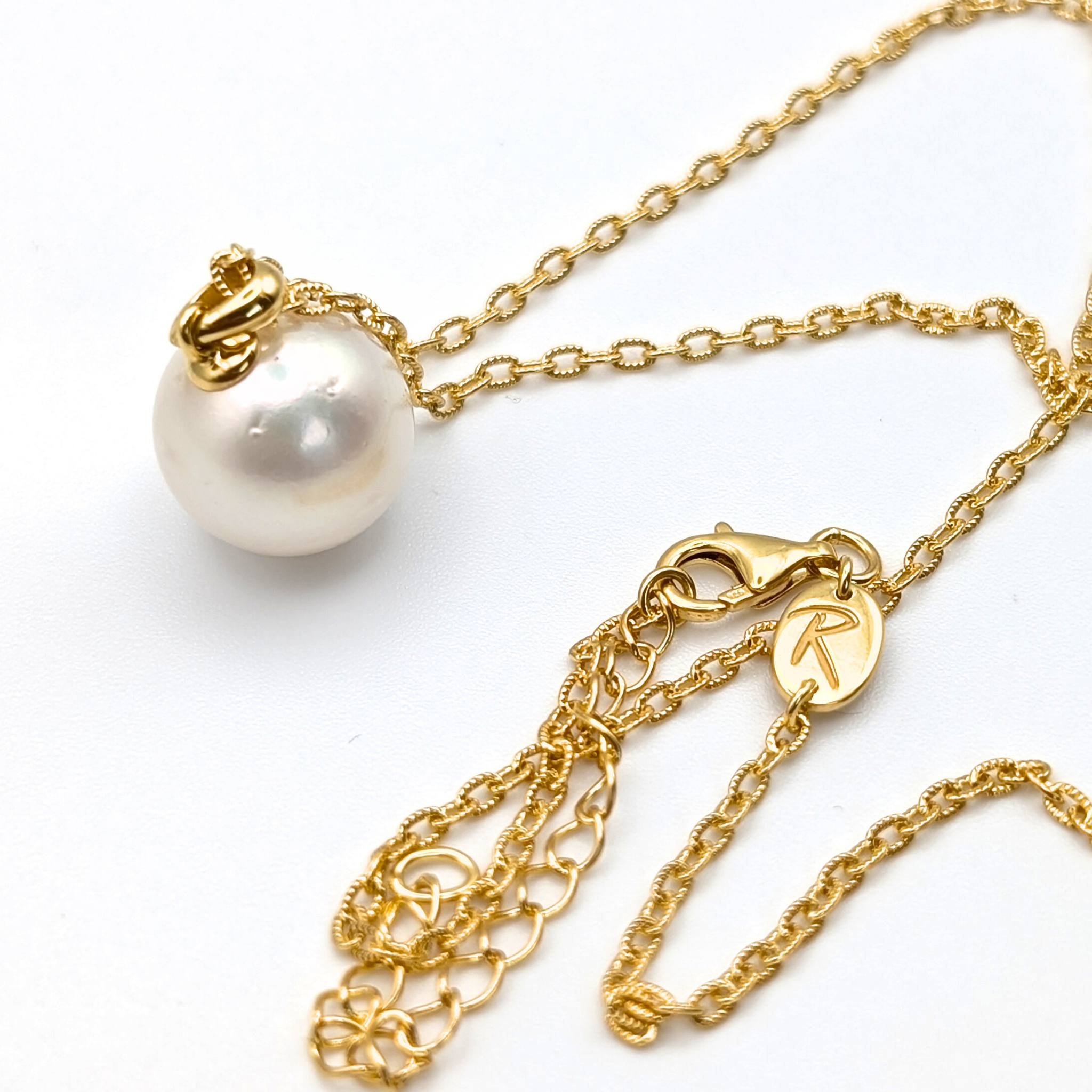 white  south sea pearl pendant necklace with gold vermeil bail and chain on white background