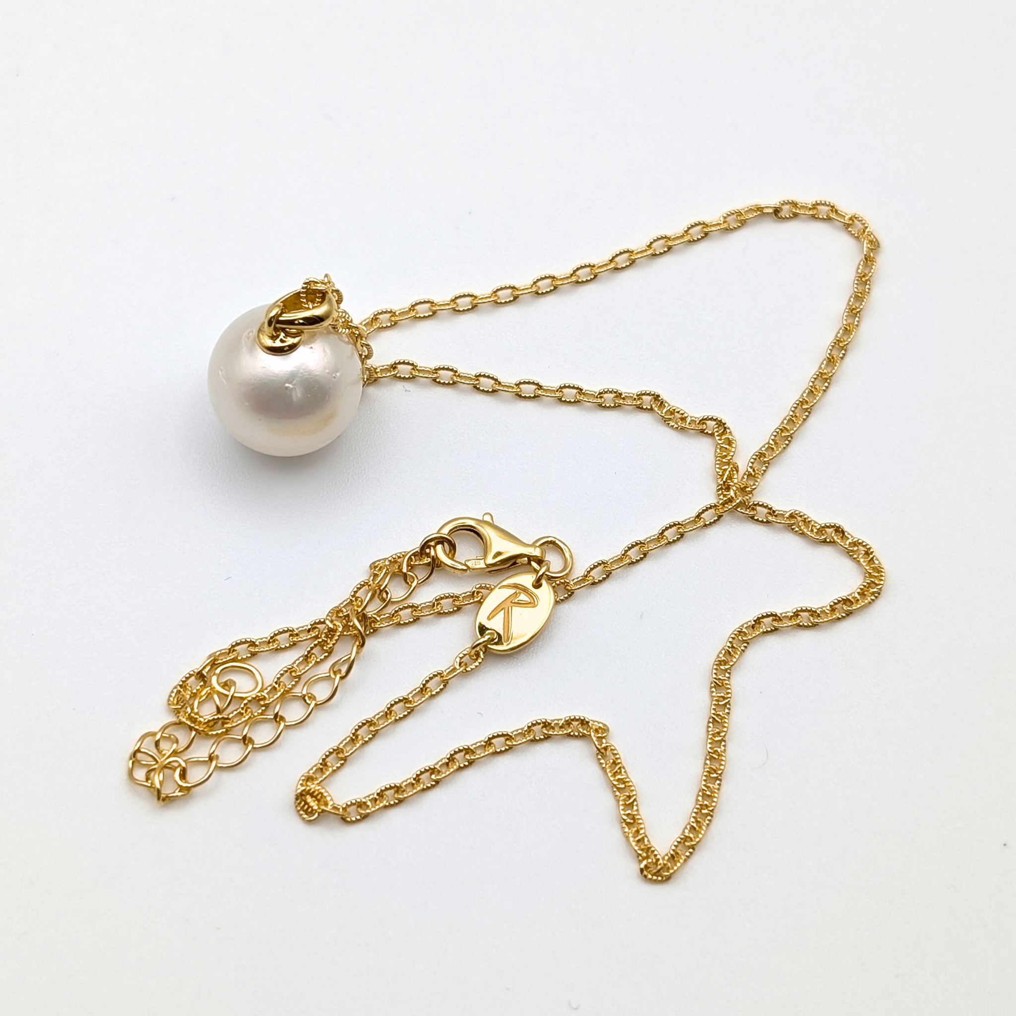 white  south sea pearl pendant necklace with gold vermeil bail and chain on white background