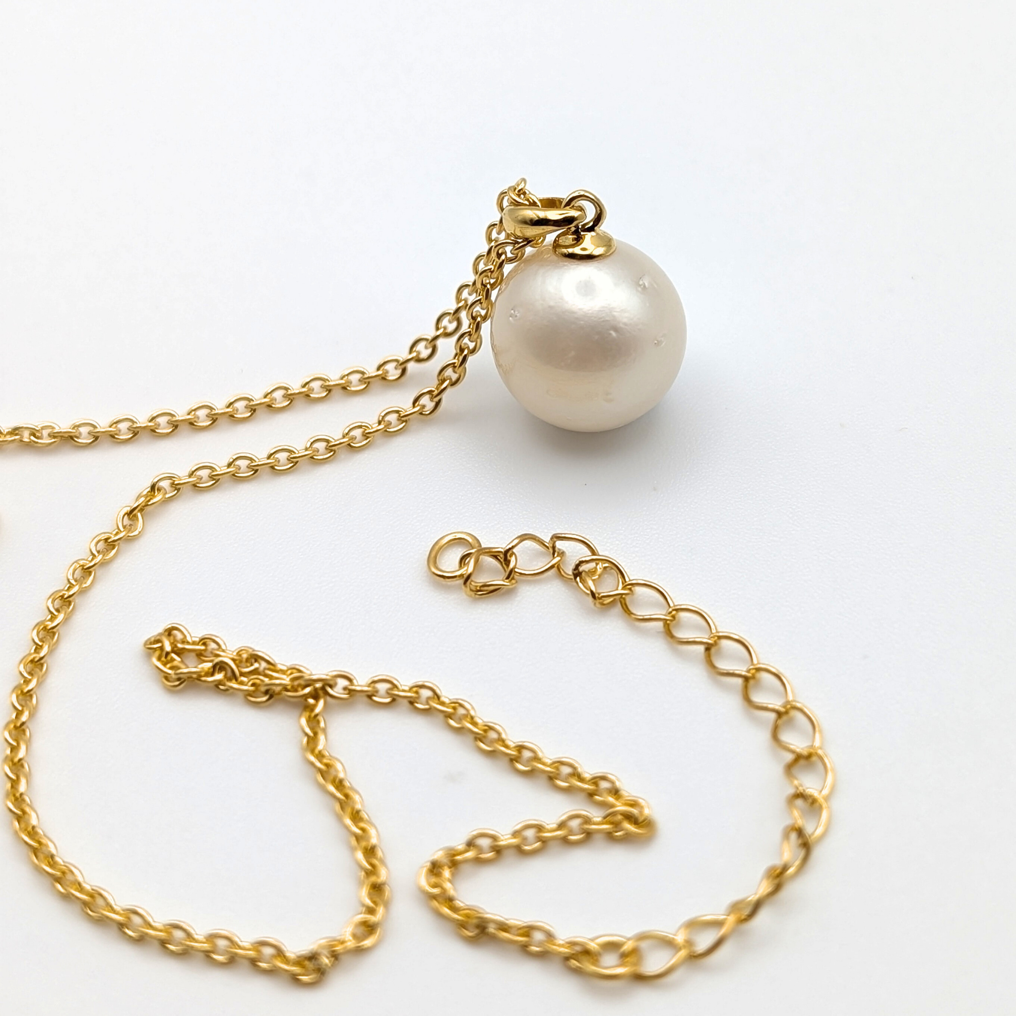 white  south sea pearl pendant necklace with gold vermeil bail and chain on white background