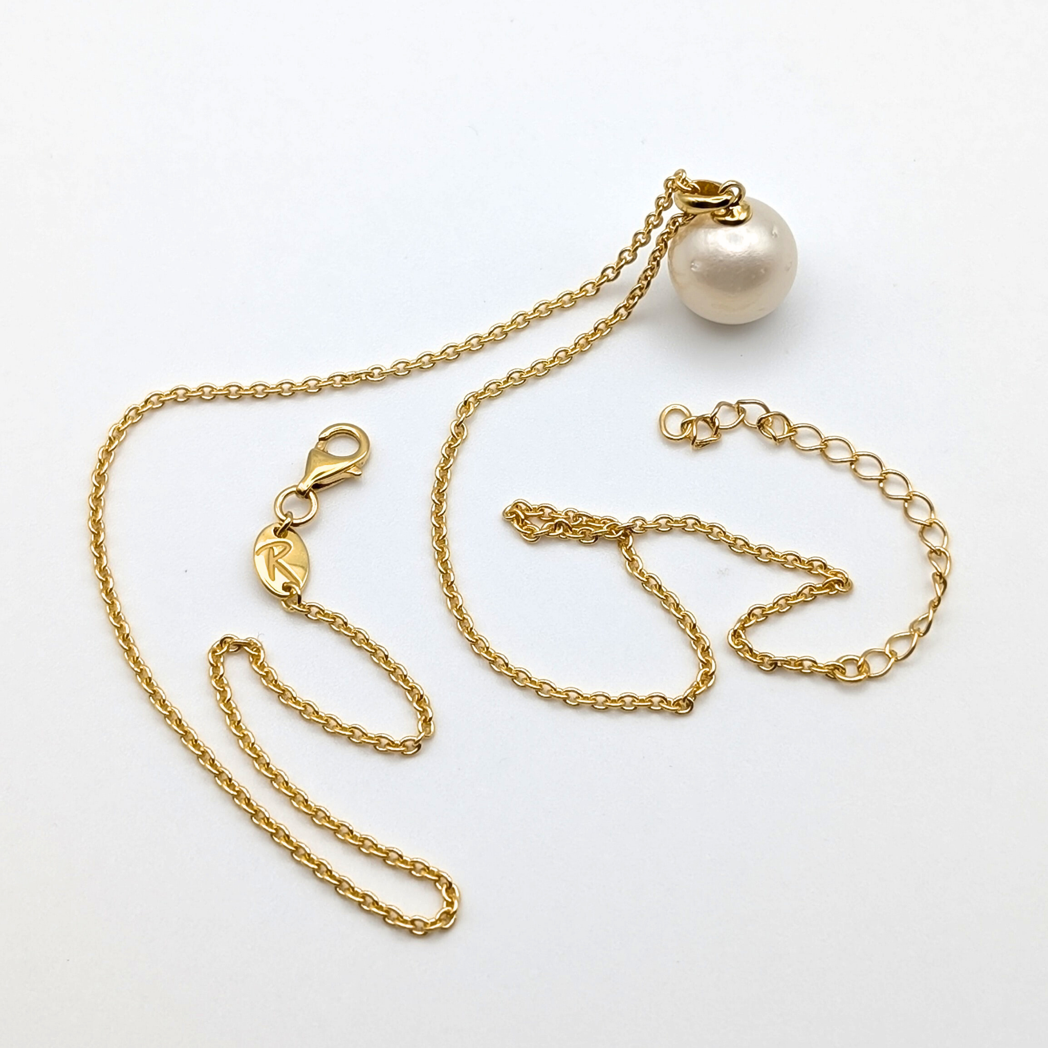 white  south sea pearl pendant necklace with gold vermeil bail and chain on white background