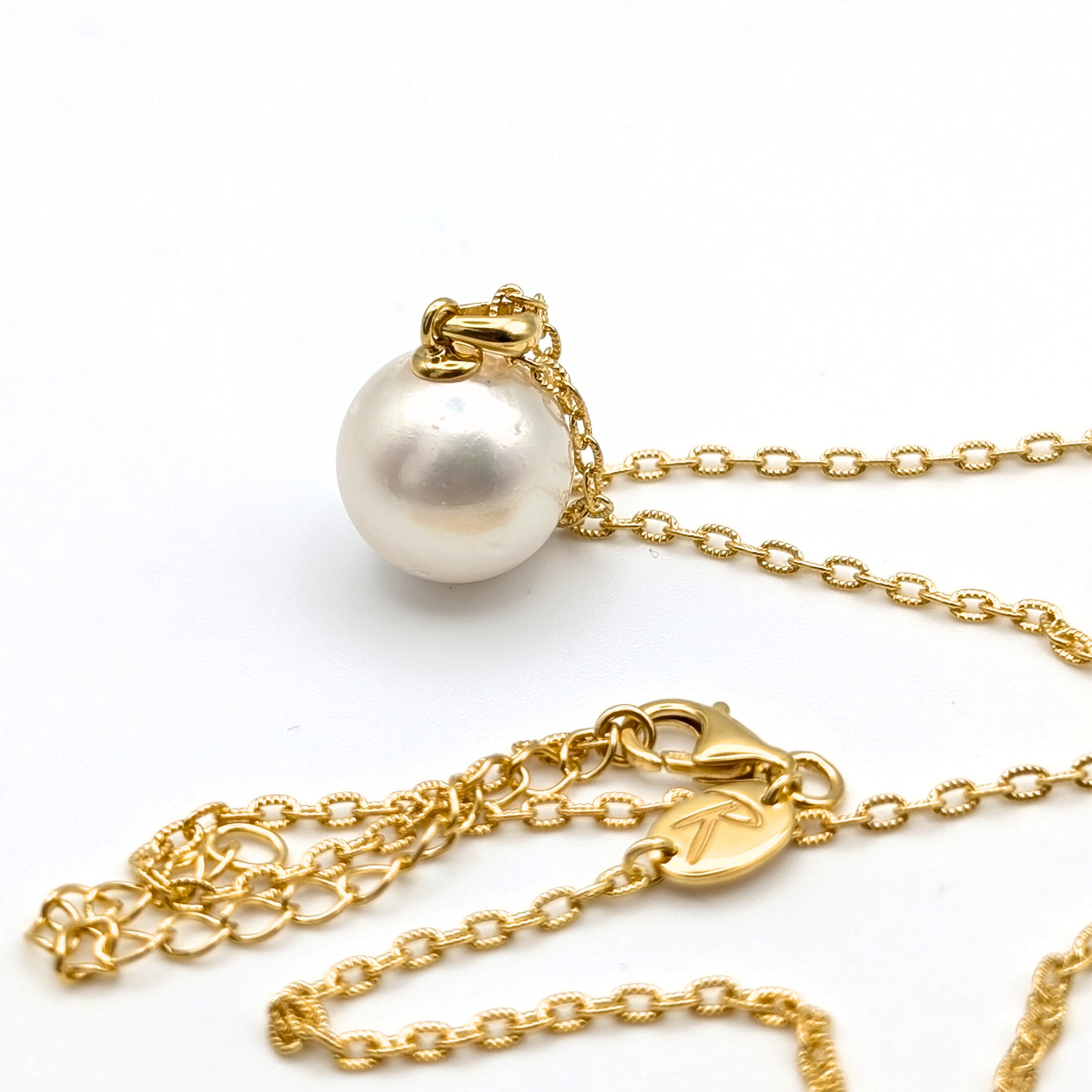white  south sea pearl pendant necklace with gold vermeil bail and chain on white background