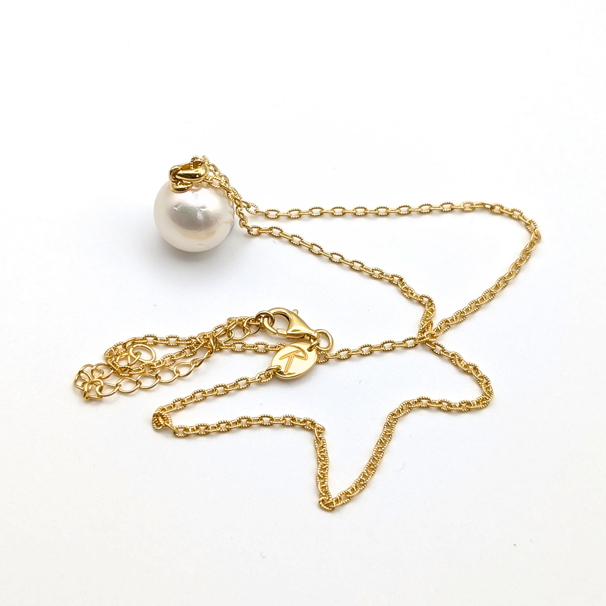 white  south sea pearl pendant necklace with gold vermeil bail and chain on white background